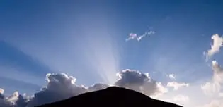 sunrise over a hill